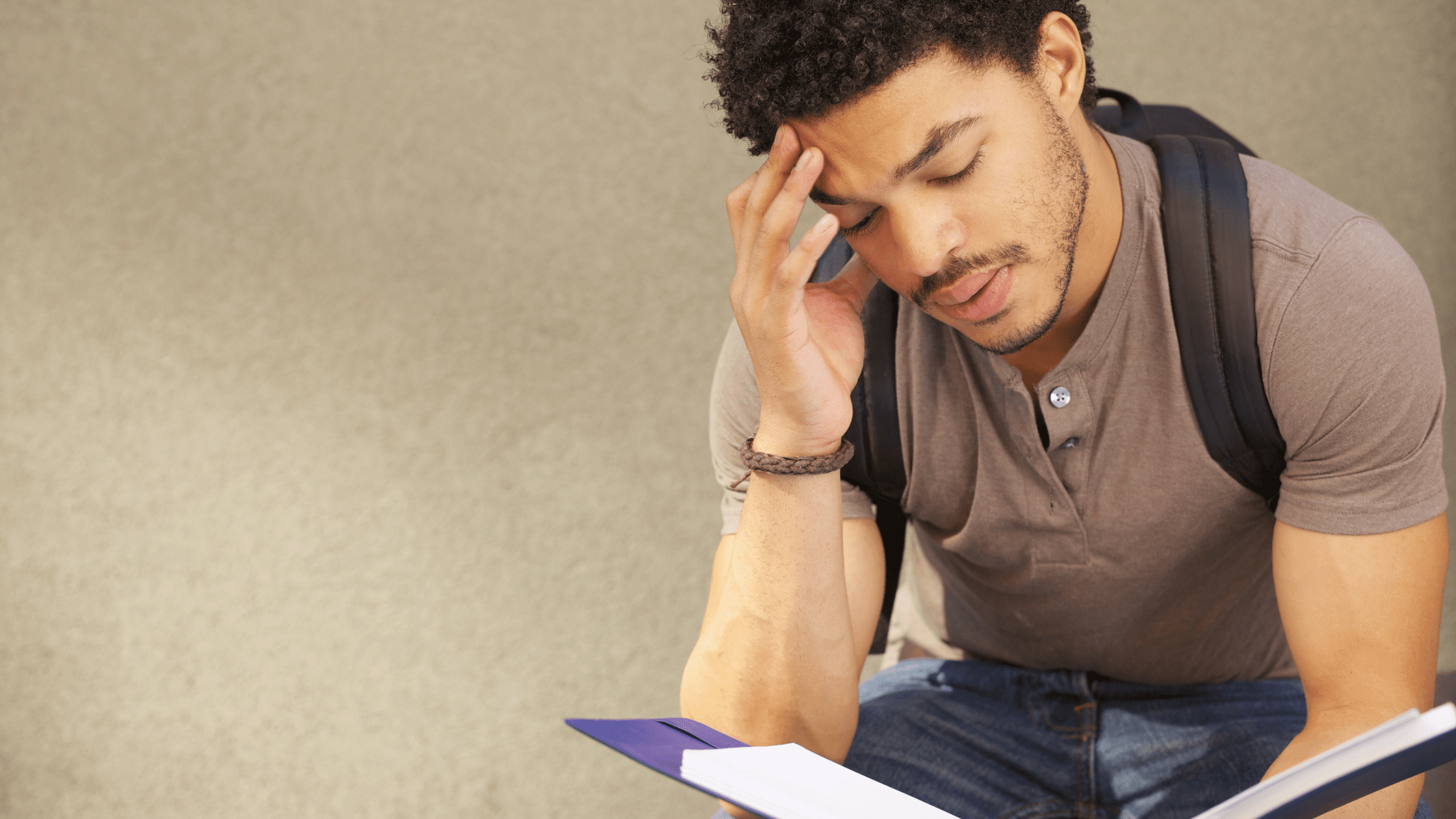 Frustrated medical school student studying for the USMLE Step 1.